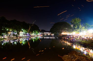 LAMPHUN, THAILAND - November 8, 2022 : Loy Krathong Festival or Yee Peng Festival at Mae Kuang River in Lamphun Province, Thailand.