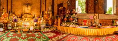 CHIANG RAI, THAILAND - July 18, 2020 : Panorama View of Ancient Buddha Statue at Wat Phrathat Pha Ngao, Chiang Rai Province.