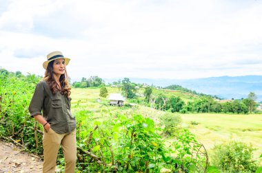 Asian Woman with Pa Bong Piang Rice Terraces at Chiang Mai Province, Thailand.