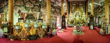 NAN, THAILAND - November 4, 2020 : Panorama View of White Buddha Statue with Beautiful Thai Style Church in Si Mongkol Temple, Nan Province.