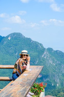 Woman Tourist with Beautiful Mountain View at Pha Hi Village, Chiang Rai Province.