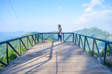 A female tourist on viewpoint platform at Pha Hi village, Chiang Rai Province.