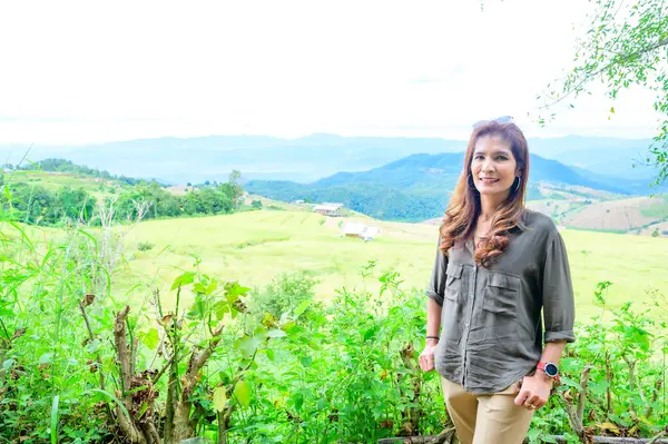 Asian Woman with Pa Bong Piang Rice Terraces at Chiang Mai Province, Thailand.