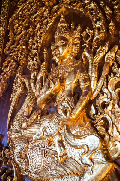 Wood carving art on the wall, Thailand.