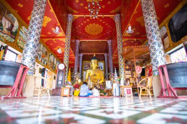 LAMPHUN, THAILAND - October 29, 2019 : Ancient Buddha statue in Phra That Hariphunchai temple, Lamphun province.