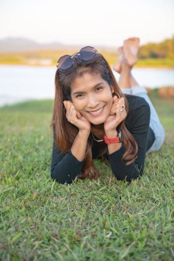 Asia woman on the grass, Thailand.