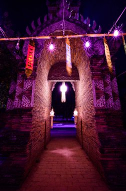 Night scene of Lanna style arch at Lok Molee temple, Chiang Mai province.