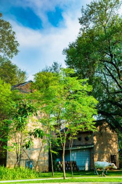 Tobacco curing building with beautiful park in Chiang Mai province, Thailand.