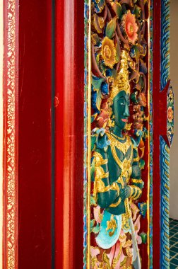 Thai carving art on the door, Thailand.