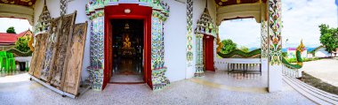 NAN, THAILAND - November 5, 2020 :  Panorama View of Old Buddha Statue with Thai Style Church in Prang Temple, Nan Province.