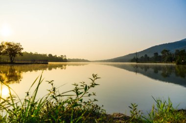 Huay Tueng Thao Lake in the early morning, the lake offers beautiful scenery, fresh air and steam rising from the surface, Chiang Mai Province.
