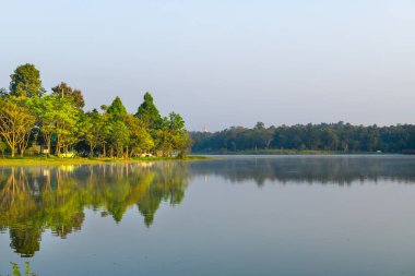 Huay Tueng Thao Lake in the early morning, the lake offers beautiful scenery, fresh air and steam rising from the surface, Chiang Mai Province.