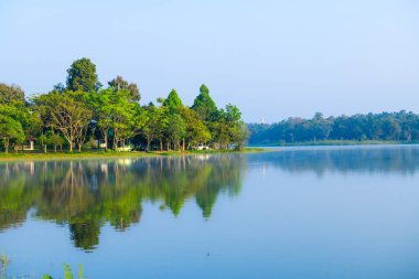 Huay Tueng Thao Lake in the early morning, the lake offers beautiful scenery, fresh air and steam rising from the surface, Chiang Mai Province.