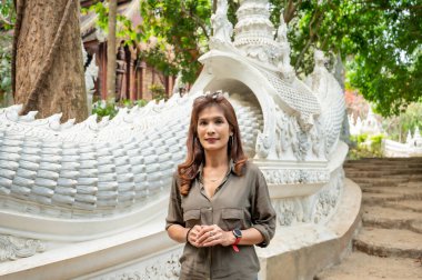 Thai woman with Thai style stair at Luang Khun Win temple, Chiang Mai Province.