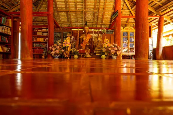 stock image CHIANG MAI, THAILAND - March 19, 2022 : Wooden Buddha Statue in Old Pavilion at Wat Luang Khun Win, Chiangmai Province.