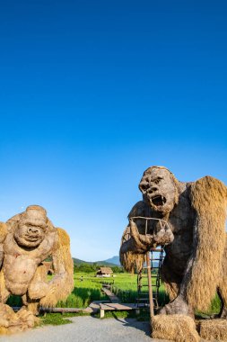 CHIANGMAI, THAILAND - September 17, 2019: King Kong straw puppets with rice field in Huay Tung Tao project, Chiangmai province.