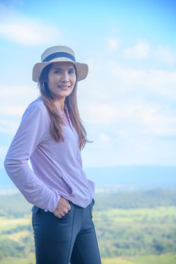 Thai Woman at Pha Hua Reua Viewpoint in Phayao Province, Thailand.