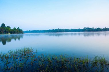 Huay Tueng Thao Lake in the early morning, the lake offers beautiful scenery, fresh air and steam rising from the surface, Chiang Mai Province.