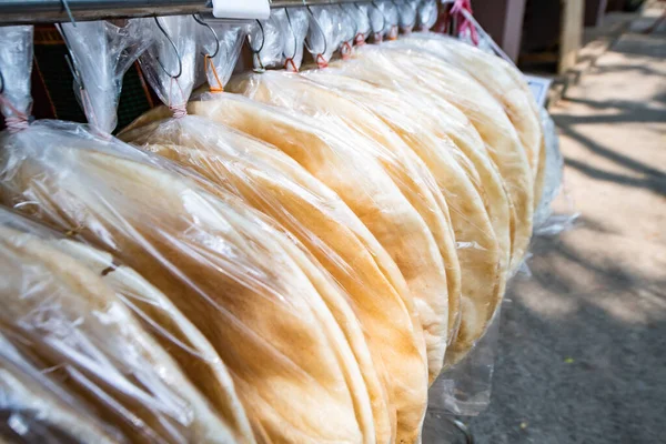 stock image Giant rice crispy in plastic bag, Thailand.