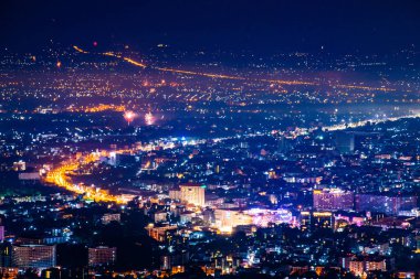 Chiangmai city with fireworks in the night, Thailand.