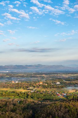 Top view of Prathat Cho Hae temple with native village in Phrae province, Thailand.