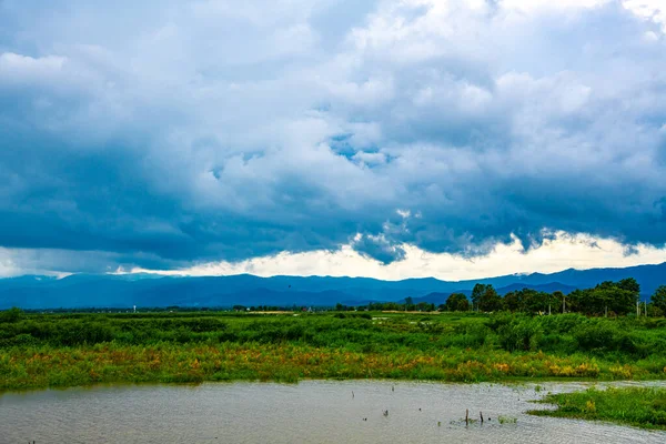 stock image Kwan Phayao lake with rainy clouds, Thailand.