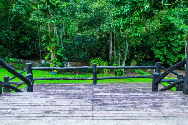 Wooden terrace in park, Thailand.