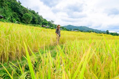 Asian Woman with Pa Bong Piang Rice Terraces at Chiang Mai Province, Thailand.