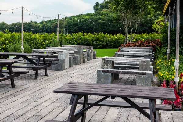 Modern table and chair in park, Thailand.