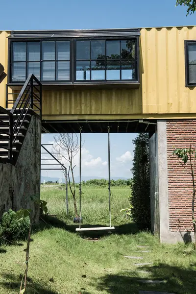 Container house with swing in Thai country, Thailand.