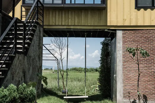 Container house with swing in Thai country, Thailand.