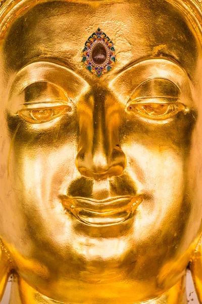 Face of golden buddha sculpture, Thailand