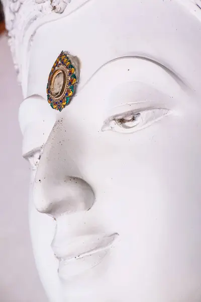 Face of white buddha sculpture, Thailand