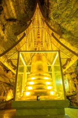 Phra Sabai cave with golden pagoda in Lampang province, Thailand.