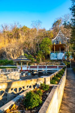 LAMPANG, THAILAND - March 7, 2020 : Landscape of park at Tham Phra Sabai temple, Lampang province.