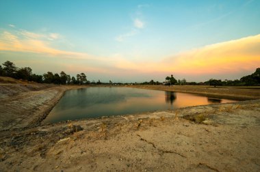 Reservoir with walkway at sunset, Chiang Mai province.