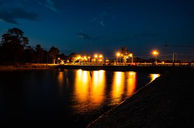 Reservoir with walkway at sunset, Chiang Mai province.