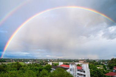 Double rainbow with local village, Chiang Mai province.