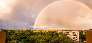 Double rainbow with local village, Chiang Mai province.