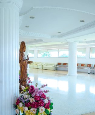CHIANG RAI, THAILAND - July 19, 2020 : Panorama View of White Building with Wooden Guanyin Statue in Huay Pla Kang Temple, Chiangrai Province.