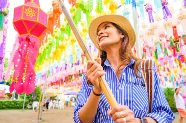 Woman Tourist in Lamphun Lantern Festival, Lamphun Thailand.