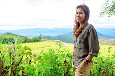 Asian Woman with Pa Bong Piang Rice Terraces at Chiang Mai Province, Thailand.