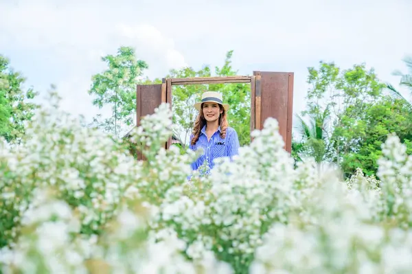 Thai Woman with Beautiful Garden at Chiang Mai Province, THailand.