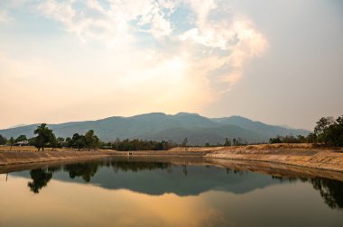 Reservoir with mountain view in Chiang Mai province, Thailand.