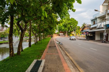 CHIANG MAI, THAILAND - April 26, 2020 : Chaeng Si Phum ancient wall with city street of Chiang Mai province, Thailand.