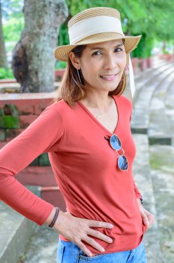 Asian woman at park in Chiang Kham district, Phayao province.