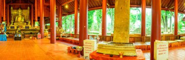 CHIANG RAI, THAILAND - July 18, 2020 :  Panorama View of Ancient Buddha Statue with Lanna Style Building in Wat Chedi Luang, Chiang Rai Province.