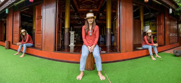 Pamorama of triple Asian women with old building background at Phayao province, Thailand.