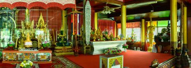 PHAYAO, THAILAND - August 13, 2020 : Pamorama of ancient Buddha statue in Wat Nantaram, Phayao province.