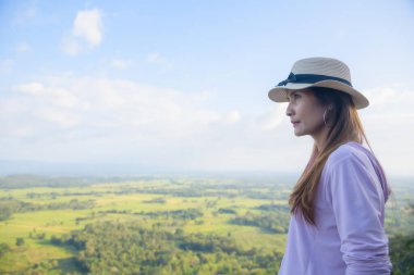 Thai Woman at Pha Hua Reua Viewpoint in Phayao Province, Thailand.